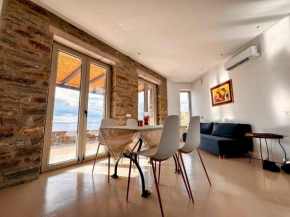 Experience Authentic Charm at Tzia Stone Apt with a Modern Twist and Sea Views